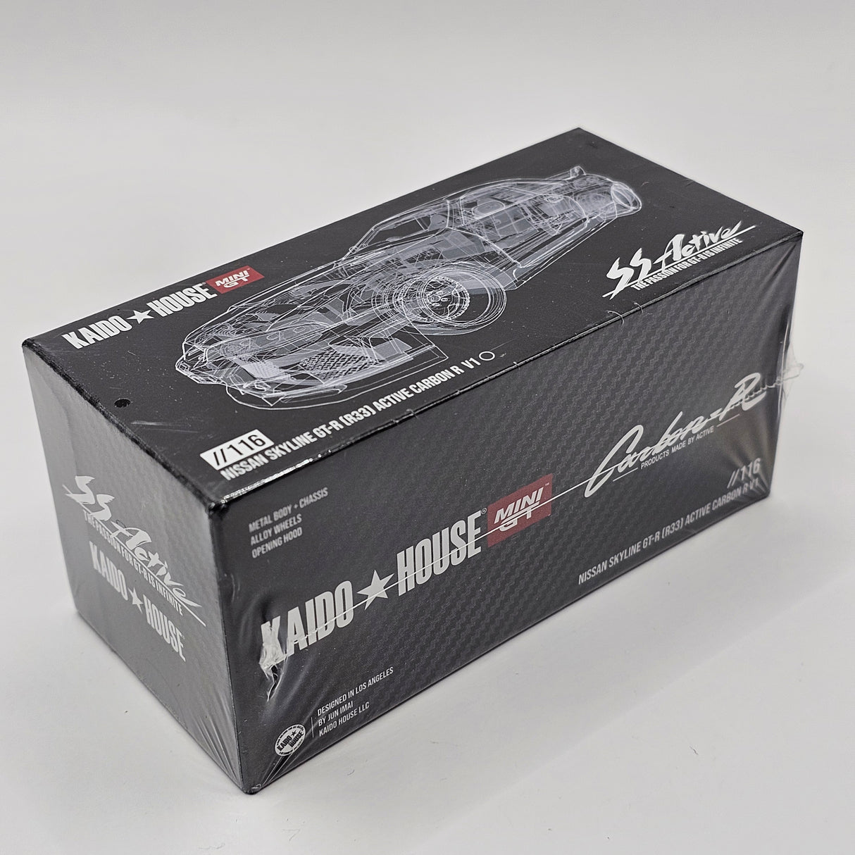 Mini GT x Kaido House Nissan Skyline GT-R (R33) Active Carbon R 1/64 Scale MGTKHMG116